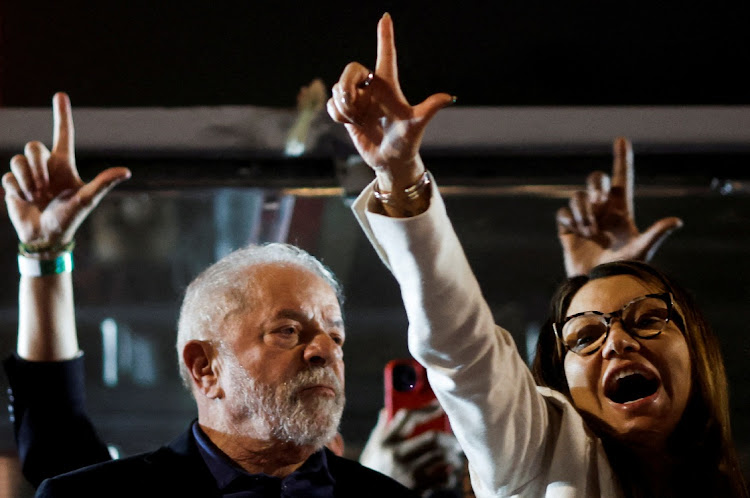 Brazil's former President and presidential candidate Luiz Inacio Lula da Silva stands next to his wife Rosangela da Silva, on the day of Brazil's presidential election, in Sao Paulo, Brazil October 2, 2022.