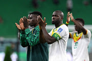 Kalidou Koulibaly (R) of Senegal applauds fans after the 3-1 win during the FIFA World Cup Qatar 2022 Group A match against Qatar at Al Thumama Stadium on November 25, 2022 in Doha, Qatar.