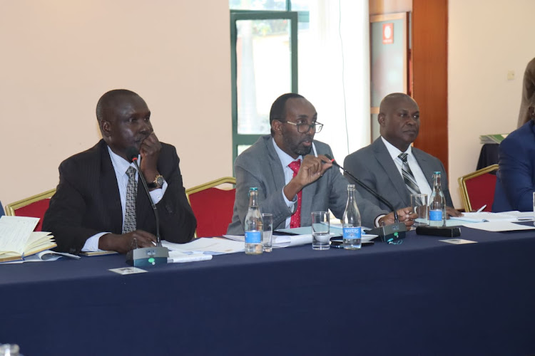 EACC Deputy CEO Abdi Mohamud (centre) with EACC Director of Legal Services David Too (Left) and Director, Field Services, Jackson Mue (Right) before the Constitutional Implementation Committee on Thursday.