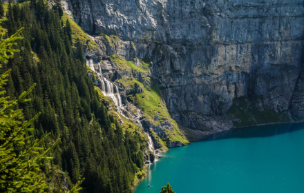 The waterfall flows into the lake small promo image