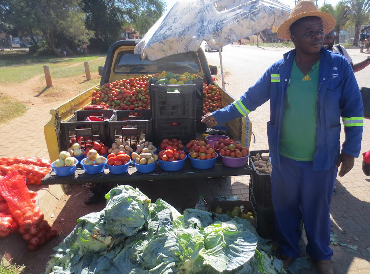 Norris Phaswana sells fruit and vegetables off the back of his bakkie in Louis Trichardt.