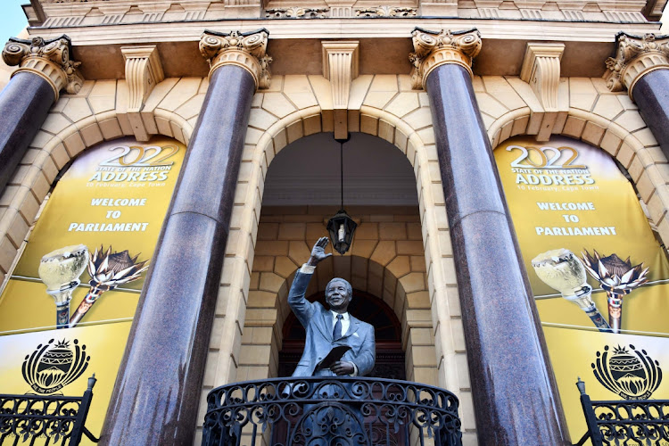 A statue of Nelson Mandela presides over preparations for the address at 7pm Thursday. PIC: ELMOND JIYANE/ GCIS