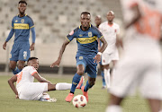 Teko Modise of Cape Town City skips past Tlolane Puleng of Polokwane City FC during the Absa Premiership 2018/19 game between Cape Town City and Polokwane City at Cape Town Stadium on 15 March 2019.