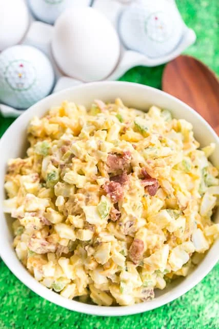 Cracked Out Egg Salad - OMG! Seriously delicious!!! Eggs, mayonnaise, Ranch mix, cheddar cheese, bacon, celery, vinegar and worcestershire. Can make ahead of time and refrigerate for later. I always make a double batch and it is gone in a flash! Everyone loves this easy egg salad recipe.