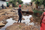 A road in Kliptown was completely destroyed by floods after a heavy downpour in Soweto on Saturday.