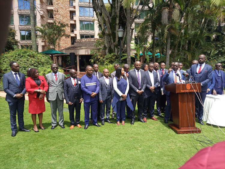 From right to the left, The Association of Real Estate Stakeholders chairman Kimani wa Iratu, the Managing director of Willstone homes,Kinyajui Gitau speaking and Members and officials of the Association during a press briefing at Nairobi Serena hotel.