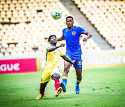 Kaizer Chiefs' Siyabonga Ngezana, right, battles with a Petro de Luanda player last night.