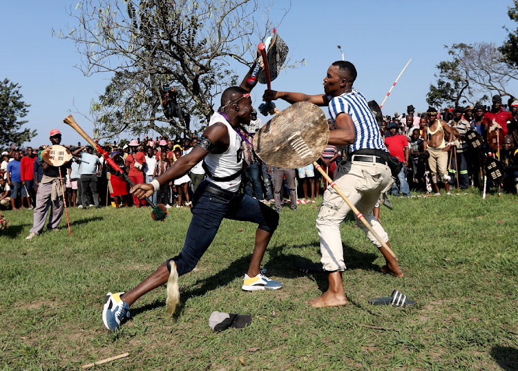 Sticks fly as the fight progresses.