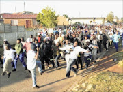 CHAOTIC: A 17-year-old boy was killed after police used live ammunition at a service delivery protest that led to the arrest of 11 people during a clash between police and residents of Siyazenzela township in the eastern highveld of Mpumalanga on Easter Monday. Pic: Adrew Hlongwane. 06/04/2010. © Sowetan.