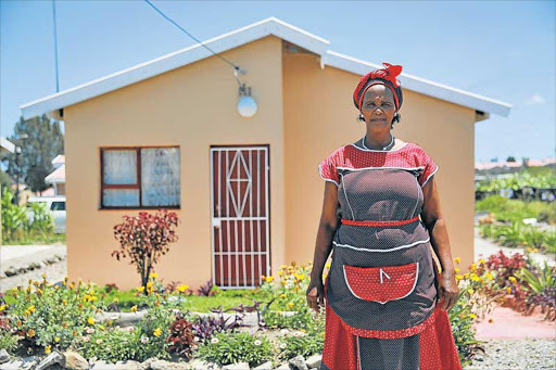 NEW BEGINNING: Thandeka Mntuyedwa finally became a home-owner two years after the construction of their houses began in 2014 Picture: MARK ANDREWS