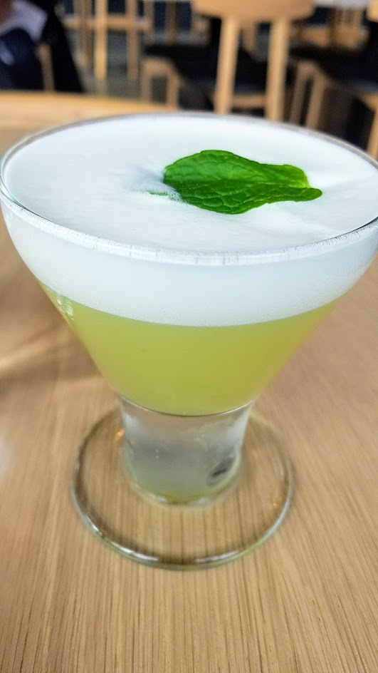 Afuri's Endomame cocktail with mint and house sugar snap pea vodka, freshly pressed lemon juice, simple syrup, and egg white