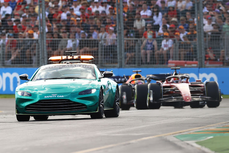 The Aston Martin FIA safety car leads the field during the F1 Grand Prix of Australia at Melbourne Grand Prix Circuit on April 10 2022 in Melbourne, Australia.