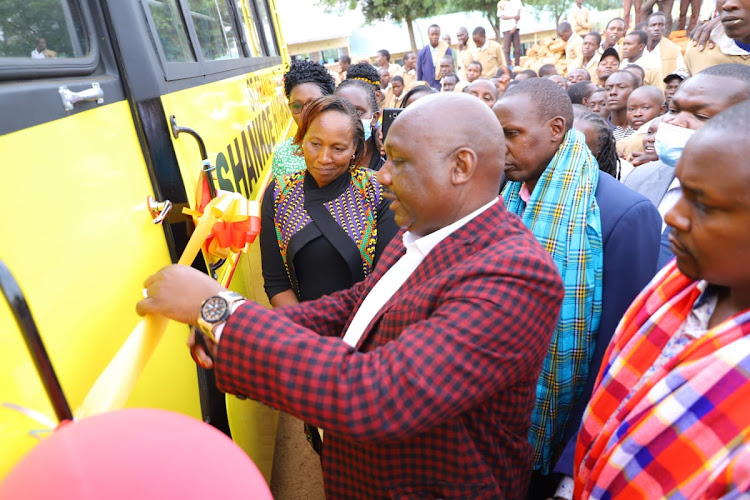 Narok Governor Samuel Tunai flags off a school bus belonging to Shankoe Secondary School in Transmara West subcounty on Wednesday.