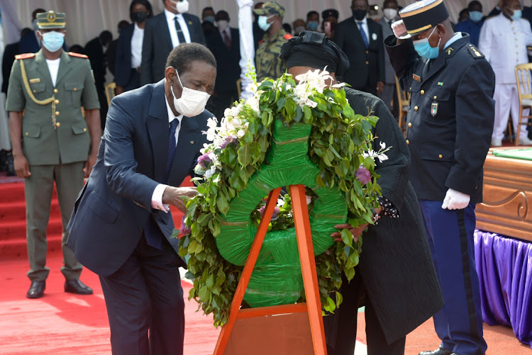 President Teodoro Obiang Nguema, lays flowers during the funeral processions for victims of explosions in Bata, Equatorial Guinea on March 12, 2021.