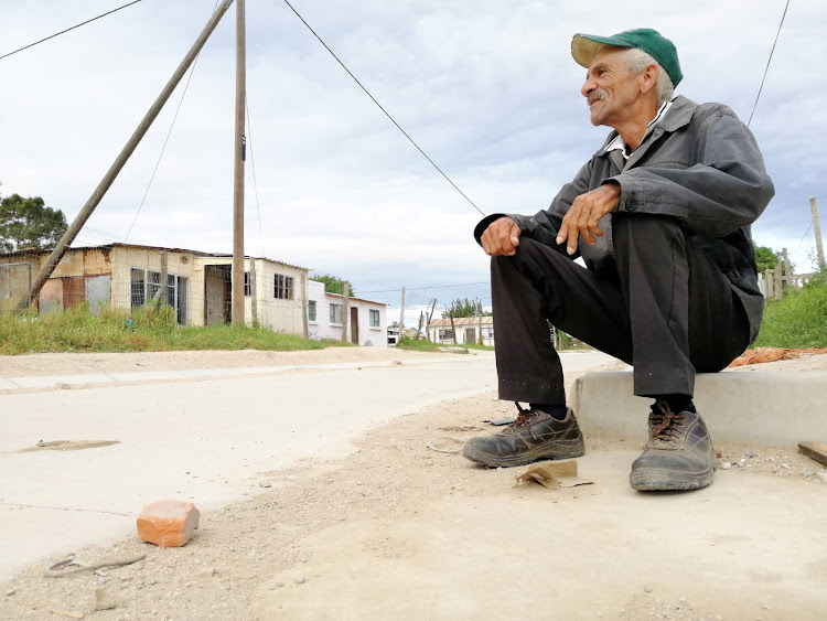 Clifford Peacock, 65, says he has nothing to do to pass the time other than to sit and wait in the township of Colchester outside Port Elizabeth. Members of the community are facing many hardships