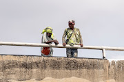 People watch from the Third Mainland Bridge during Akinrodoye Samuel's 'Swim Against Suicide And Depression' in Lagos, Nigeria, on March 30 2024.