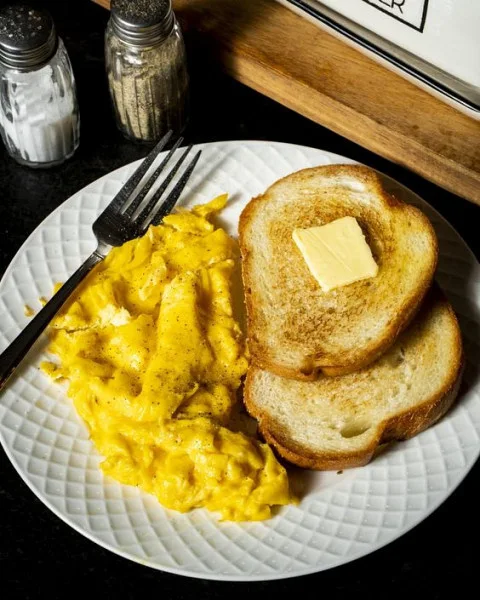 Scrambled Eggs With Toast And Butter