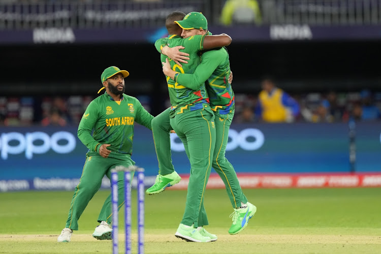 Lungi Ngidi, centre, celebrates a wicket with teammate David Miller during the 2022 ICC Men's T20 World Cup match between South Africa and India at Optus Stadium in Perth, Australia. October 30 2022. Picture: ISURU SAMEERA PEIRIS/GALLO IMAGES