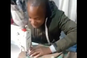 A man is seen on a social media clip allegedly sewing SANDF camouflage cloth. 