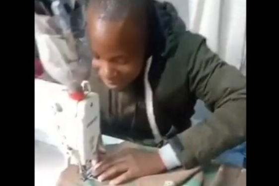 A man is seen on a social media clip allegedly sewing SANDF camouflage cloth.