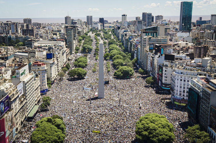 An aerial view of the Obelisk as millions of Argentine fans gather in Buenos Aires for a victory parade for the World Cup winners on December 20 2022.