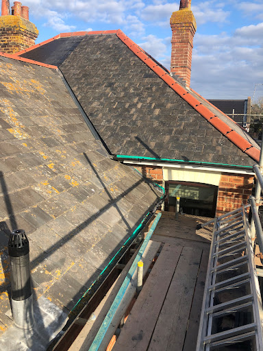 Strip old felt and batten . Install new breathable felt 