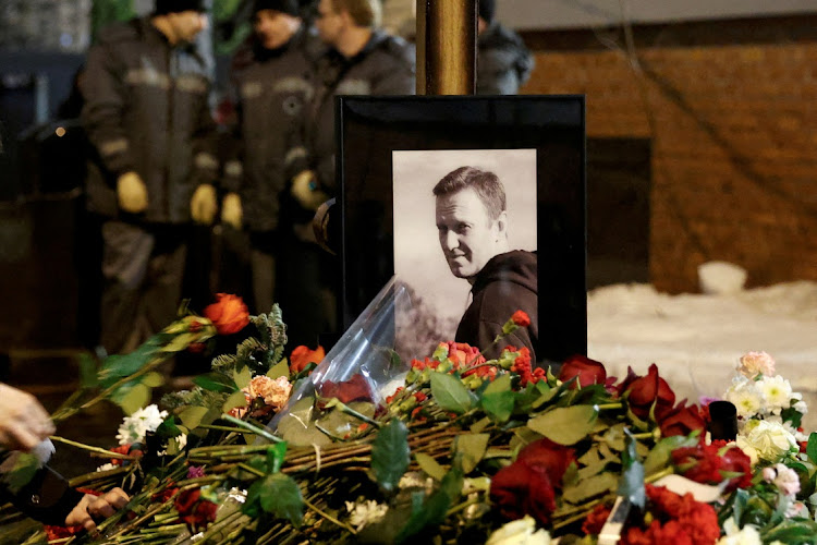 People lay flowers at the grave of Russian opposition politician Alexei Navalny in Moscow, Russia, March 1 2024. Picture: REUTERS