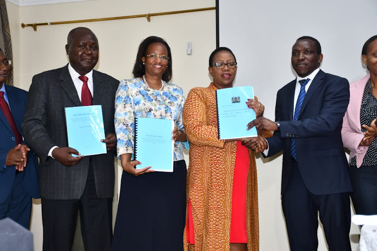 Acting director general of health Wekesa Masasabi, Health PS Susan Mochache, Health CS Sicily Kariuki and NHIF reform panel chairman James Wambugu when he presented the report to the ministry in Nairobi on October 24, 2019.