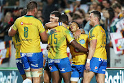 The Bulls celebrate a try scored by Bulls reserve halfback Embrose Papier (c) during the Super 15 Rugby match - Chiefs v Bulls played at FMG Stadium Waikato, Hamilton, New Zealand on Friday 16 March 2018. 