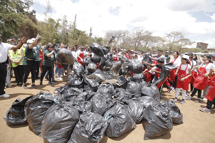 Ismaili council members world throw off garbage collected at city park market as they mark the second global world civic day at city the market on September 25, 2022/ CHARLENE MALWA.