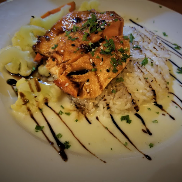 Vietnamese Caramel Salmon (or Cod) served over coconut sticky rice with steamed vegetables, sweet & spicy caramel sauce and beurre blanc sauce. All sauces are gluten free. If you have additional dietary restrictions our kitchen will gladly accommodate your needs!