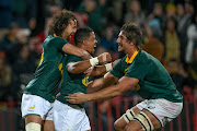 Dillyn Leyds, Rudy Paige and Eben Etzebeth(C) of South Africa celebrates during the 3rd Castle Lager Incoming Series Test match between South Africa and France at Emirates Airline Park on June 24, 2017 in Johannesburg.