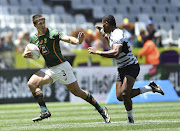 Impi Visser of South Africa and Jeremaia Matana of Fiji during the match on day 2 of the HSBC Cape Town Sevens at DHL Stadium on December 10.