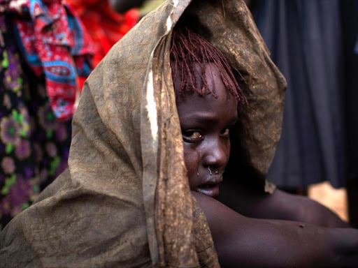 A Pokot girl, during female genital mutilation which involves cutting off the clitoris and external genitalia, then stitching the vagina to reduce a woman's sexual desire. Photo/REUTERS