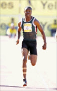 FLYER: Simon Magakwe wins the 100m event at the SA Championships in Stellenbosch. Cicra 2009. Pic. Luigi Bennett.  © Backgapepix.