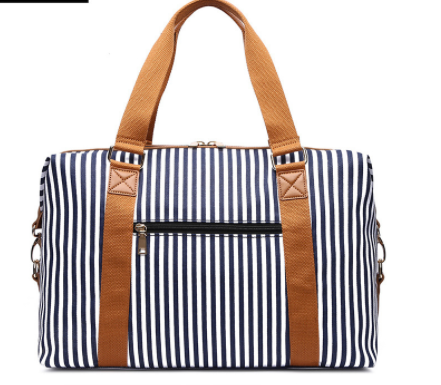 Sac de voyage à rayures en toile pour femmes, spacieux et élégant, parfait pour les escapades et les voyages.