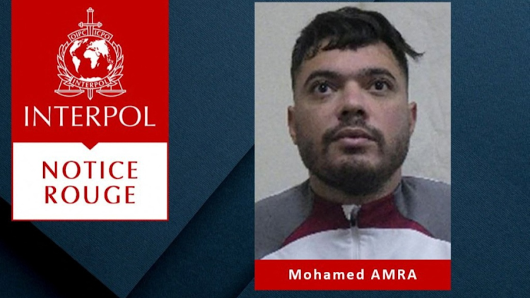 Interpol logo and graphics with an undated mugshot of 30-year-old French inmate Mohamed Amra, also known as "The Fly", who was freed by accomplices in a May 14 2024 prison van attack that left two guards dead and three injured.