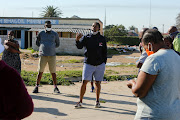 Concerned resident  Lawula Ntshona raises his concerns at a public meeting in New Brighton’s Embizweni Square on Monday. On Saturday night, a large group of youngsters consumed alcohol at a street bash on the square in defiance of the coronavirus lockdown regulations   