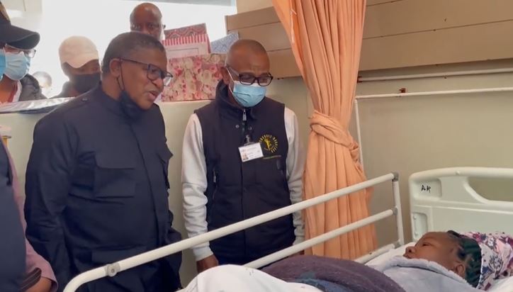 Transport minister Fikile Mbalula with RAF CEO Collins Letsoalo speak with a victim of Friday's Tshwane horror crash.