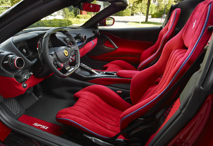 The Alcantara seats are also coloured a bold shade of Rosso Passionale.