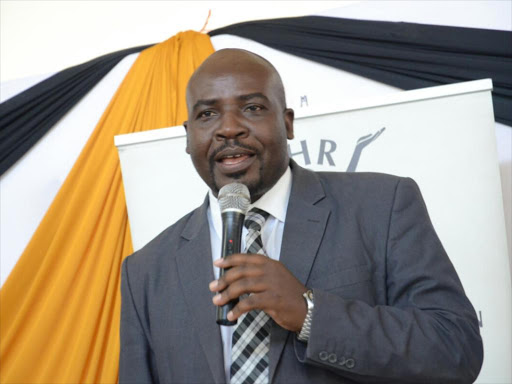 KNCHR vice chairman George Morara speaking while launching the inquiry report on mining in Taita Taveta and its impact on the enjoyment of human rights, in Mwatate on May 30, 2019. /SOLOMON MUINGI