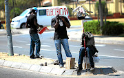 Young manual labourers wait for potential employers at a road  intersection  on Witkoppen Road, in Fourways, northern Johannesburg. Unskilled youths are finding it hard to secure jobs.   