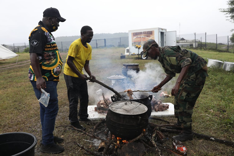 MKMVA members prepare lunch outside former president Jacob Zuma's home in Nkandla.