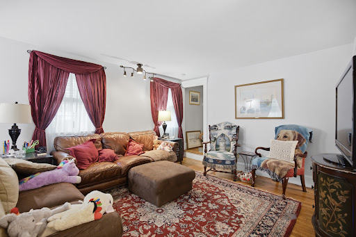 Living room with brown leather sofa, rug - Luxury apartment / penthouse for sale in Stow, 3 bedrooms