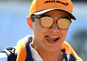 Lando Norris looks on in the paddock during previews before the F1 Grand Prix of Australia at Melbourne Grand Prix Circuit on March 12 2020 in Melbourne, Australia. The race was eventually cancelled due to the coronavirus pandemic.