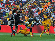 Kaizer Chiefs striker Gustava Paez is challenged by Issa Sarr ,Abbubaker Mobara and Justice Chabalala of Orlando Pirates during Absa Premiership 2017/18 match between Kaizer Chiefs and Orlando Pirates at FNB Stadium ,Johannesburg South Africa on 21 October 2017.