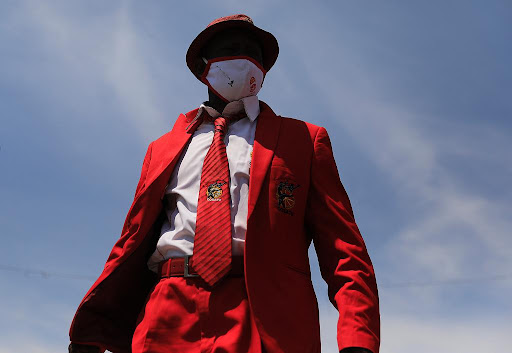 A Cosatu member shows off the colours in Newtown, Johannesburg on Thursday, October 7 2021, as part of a nationwide stay away. Cosatu is protesting against corruption, retrenchments and increasing job losses across the country.