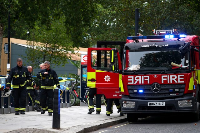 Fire fighters attend the scene after a car crashed outside the Houses of Parliament in Westminster, London, Britain, August 14, 2018.