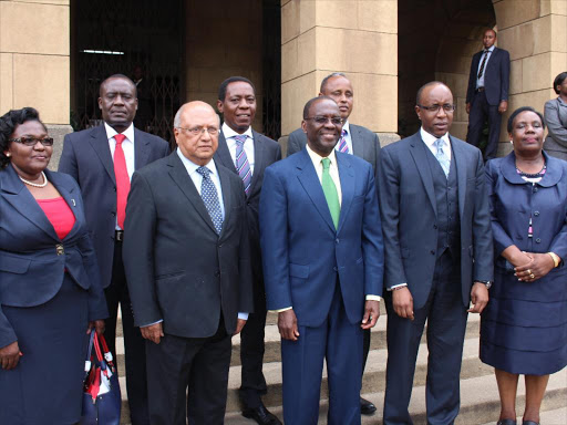 Investigators: Chief Justice Willy Mutunga (in green tie) poses for a photo with tribunal members Roselyn Korir, George Munji, chairman Sharad Rao, James Gachoka, Abdirashid Hussein, solicitor General Njee Muturi and Judith Guserwa at the Supreme Court on March 2.