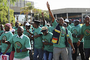 AMCU members leave Rustenburg Civic Centre on November 28, 2012, in Rustenburg after president Joseph Mathunjwa gave  testimony at the Marikana massacre Commission of Inquiry.